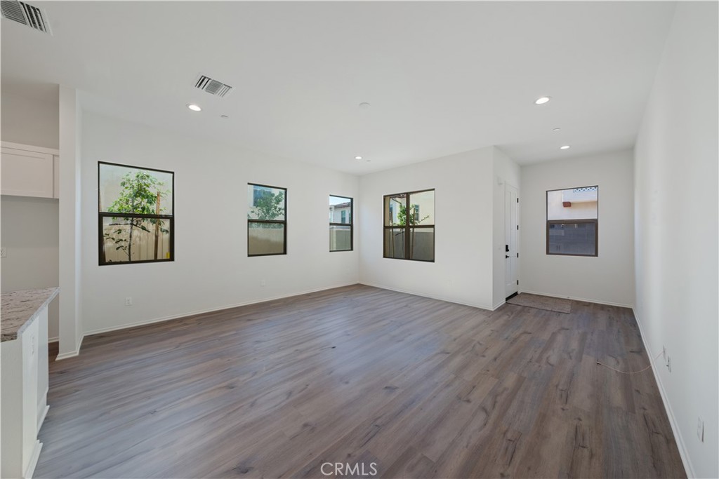 810 Francesca Drive Walnut, CA 91789 - Photo 22 of 33 an empty room with wooden floor and windows