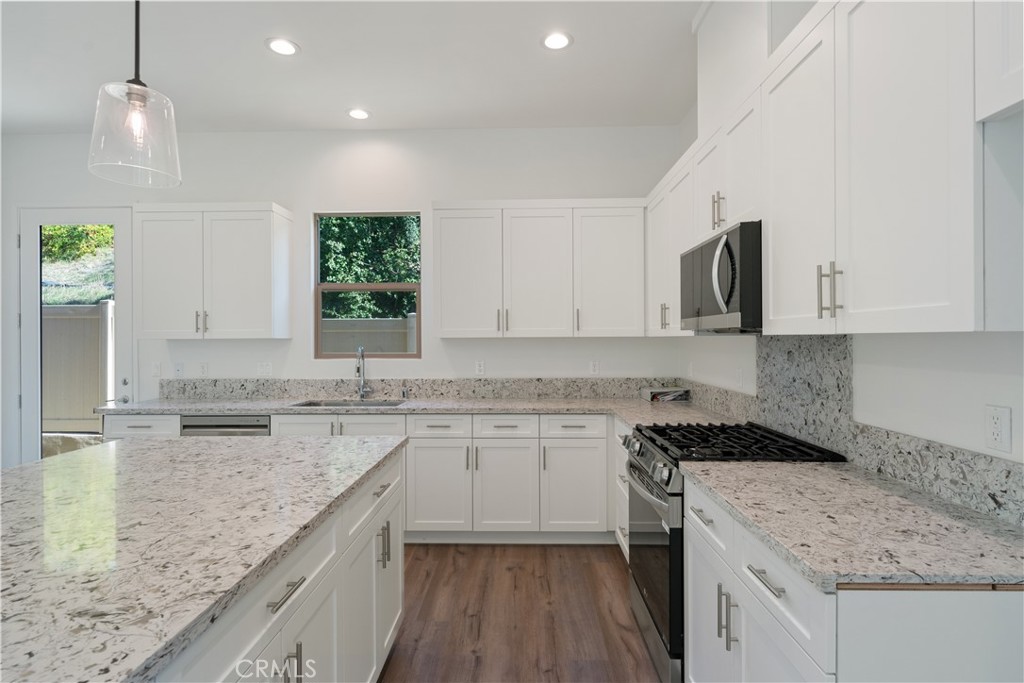 810 Francesca Drive Walnut, CA 91789 - Photo 24 of 33 a kitchen with granite countertop a sink stove and cabinets