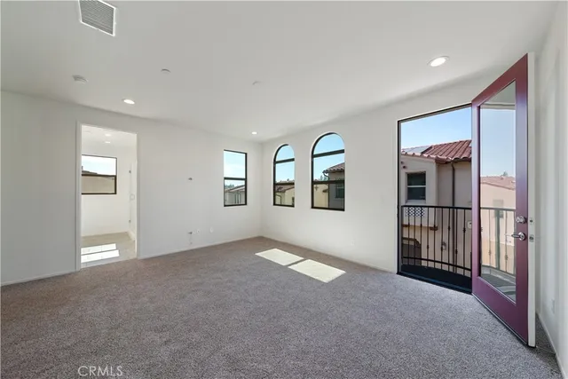 a view of empty room with windows