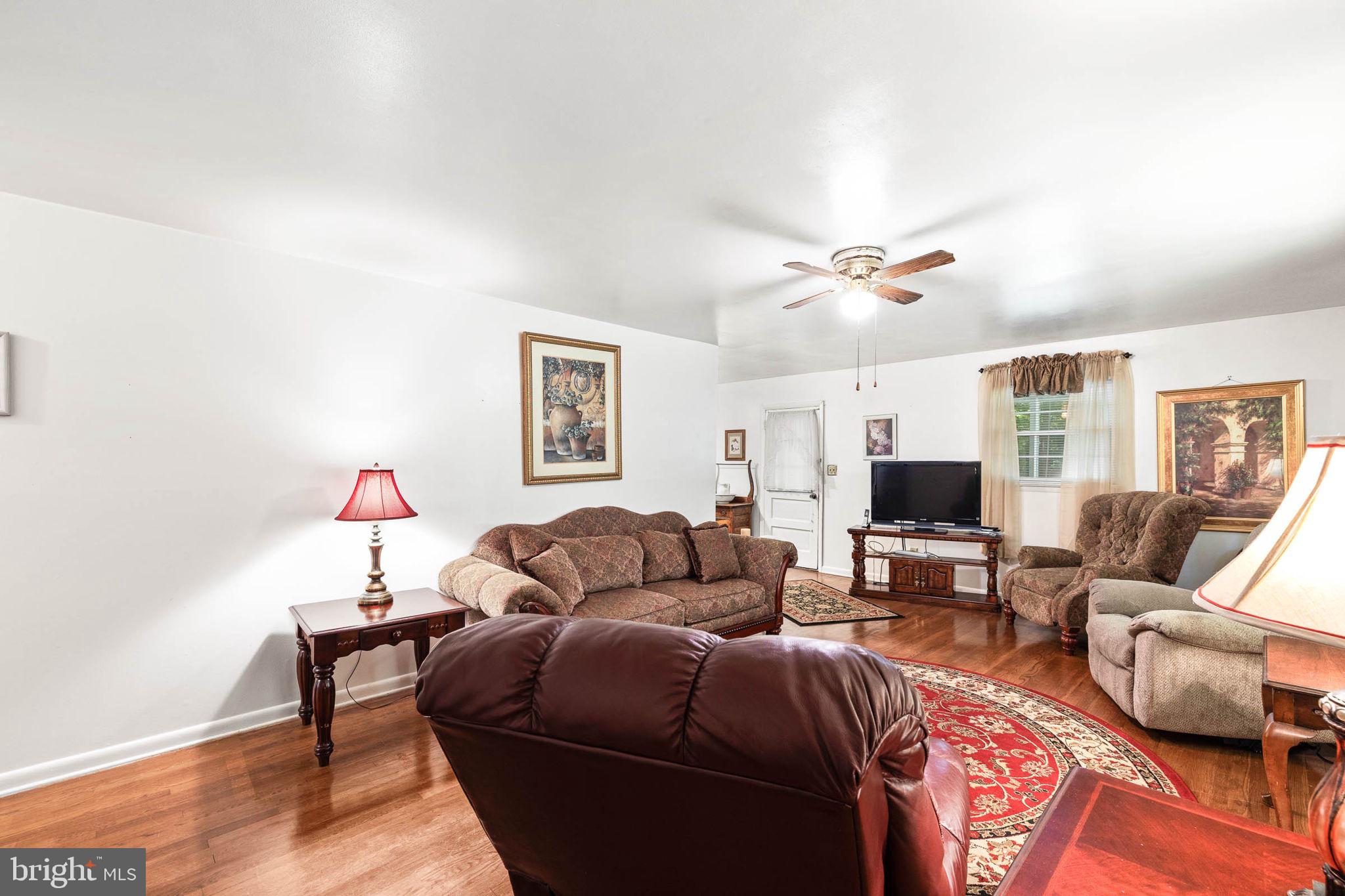 124 Potomac Run Road Fredericksburg, VA 22405 - Photo 8 of 39 Living Room with Hardwood Floors and Fan