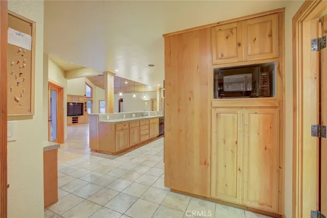 a view of a kitchen from the hallway