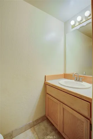 a bathroom with a sink and vanity