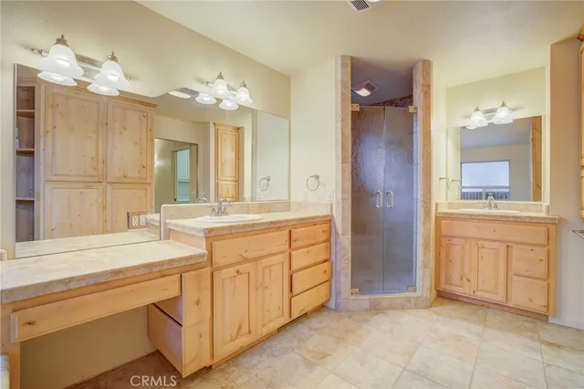 a bathroom with a sink vanity and a mirror
