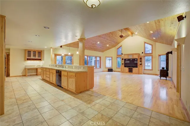 a large white kitchen with a large window