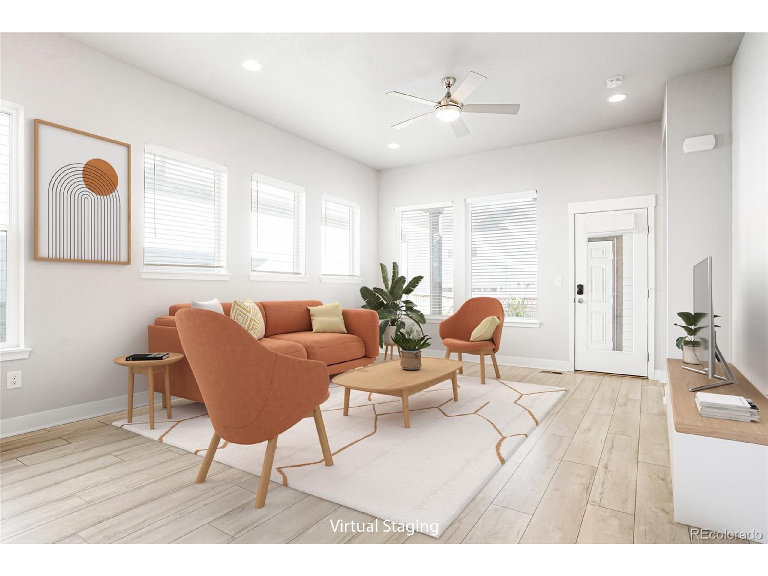 20968 East 60th Place Aurora, CO 80019 - Photo 11 of 50 a living room with furniture and wooden floor