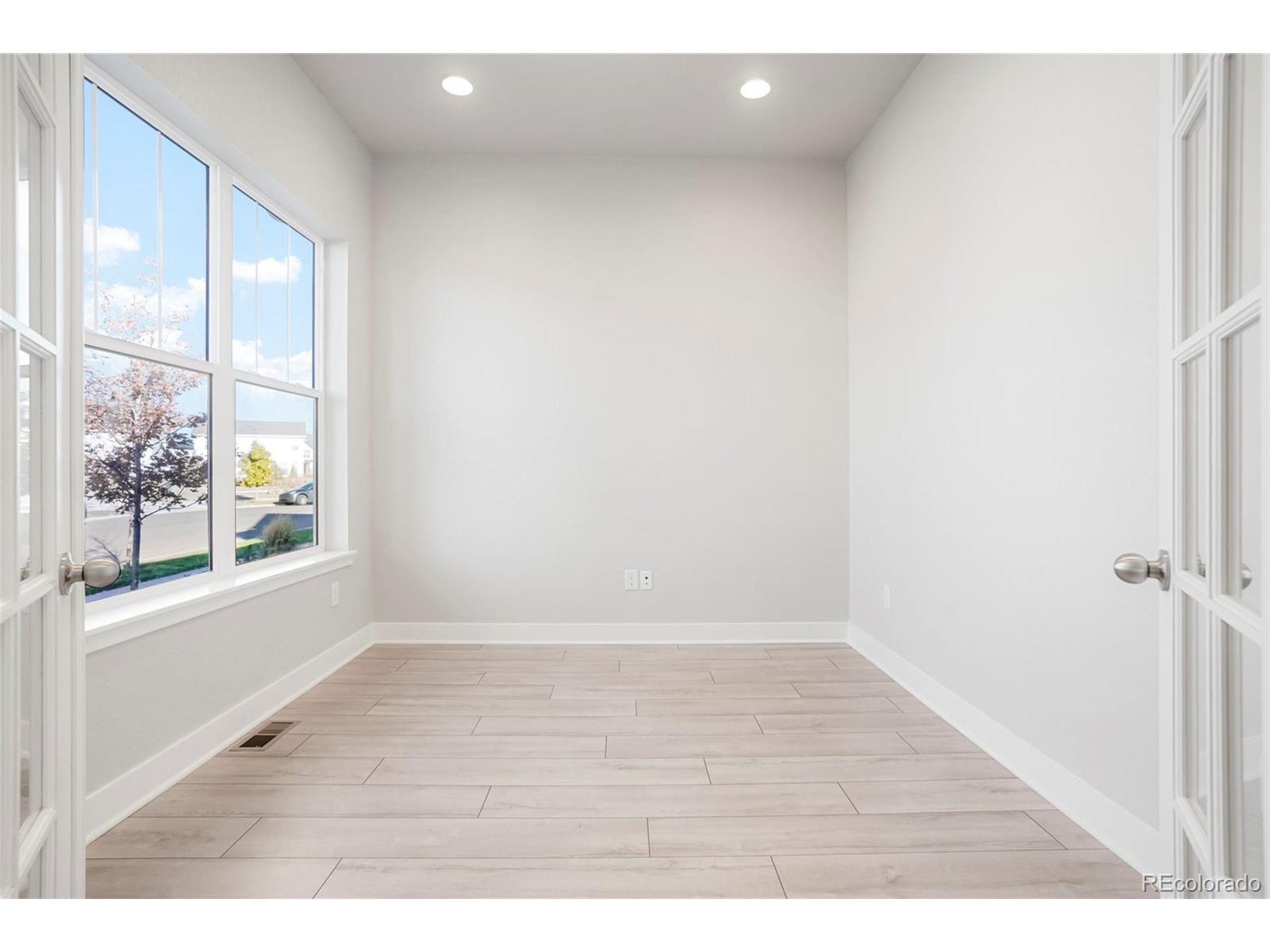 20968 East 60th Place Aurora, CO 80019 - Photo 19 of 50 a view of an empty room with a window