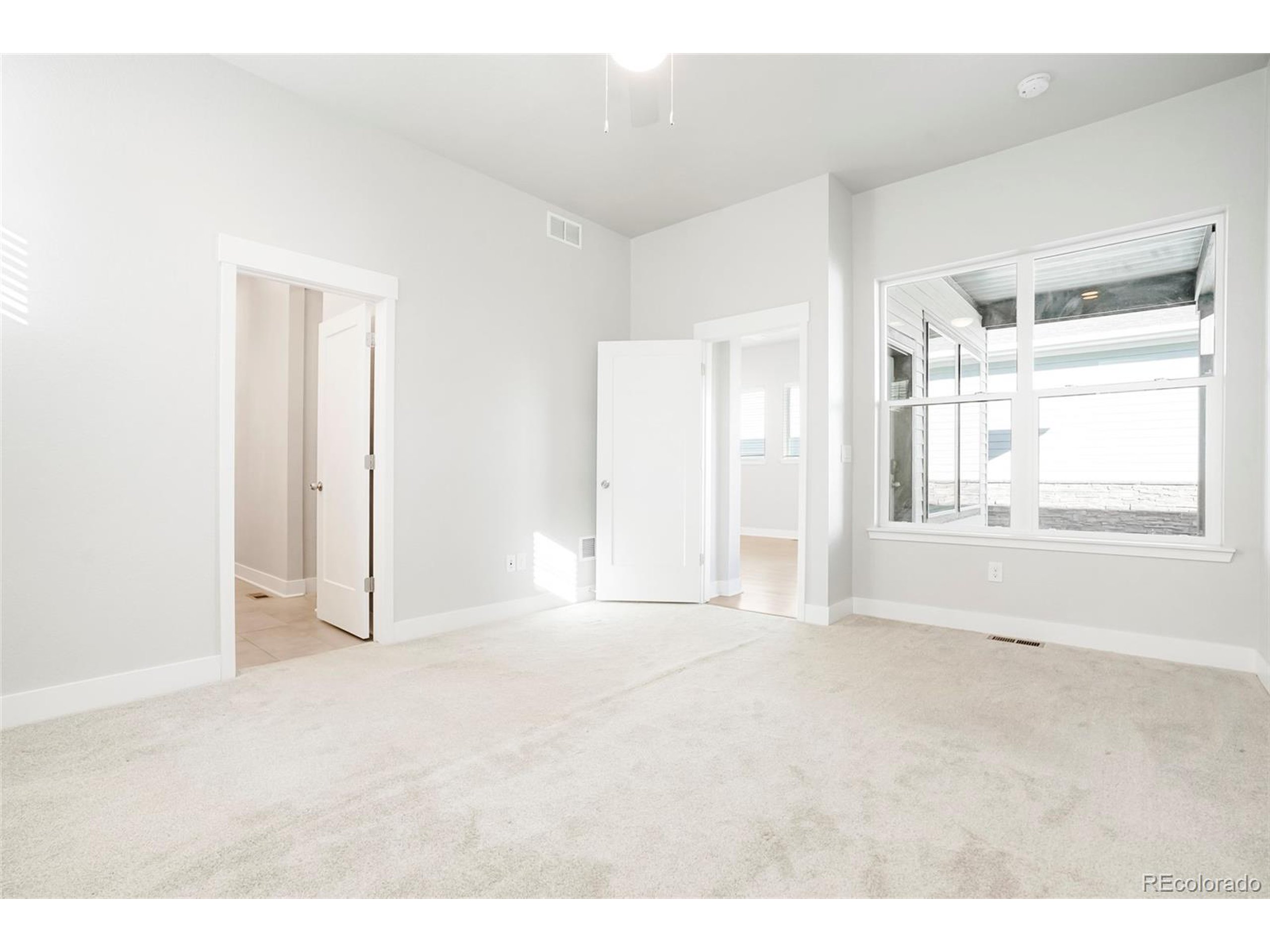 20968 East 60th Place Aurora, CO 80019 - Photo 21 of 50 a view of an empty room with a window