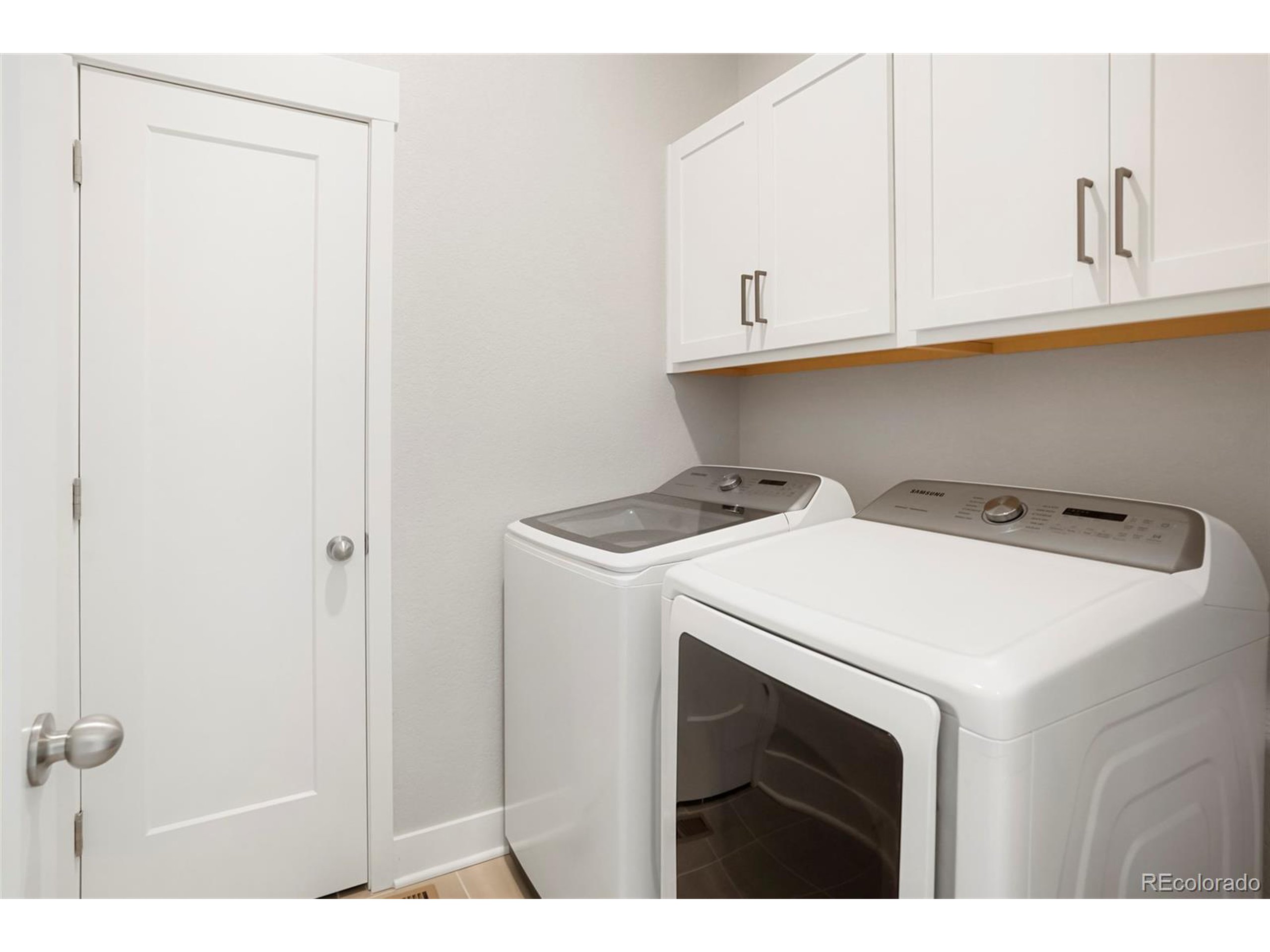 20968 East 60th Place Aurora, CO 80019 - Photo 27 of 50 a utility room with dryer and washer