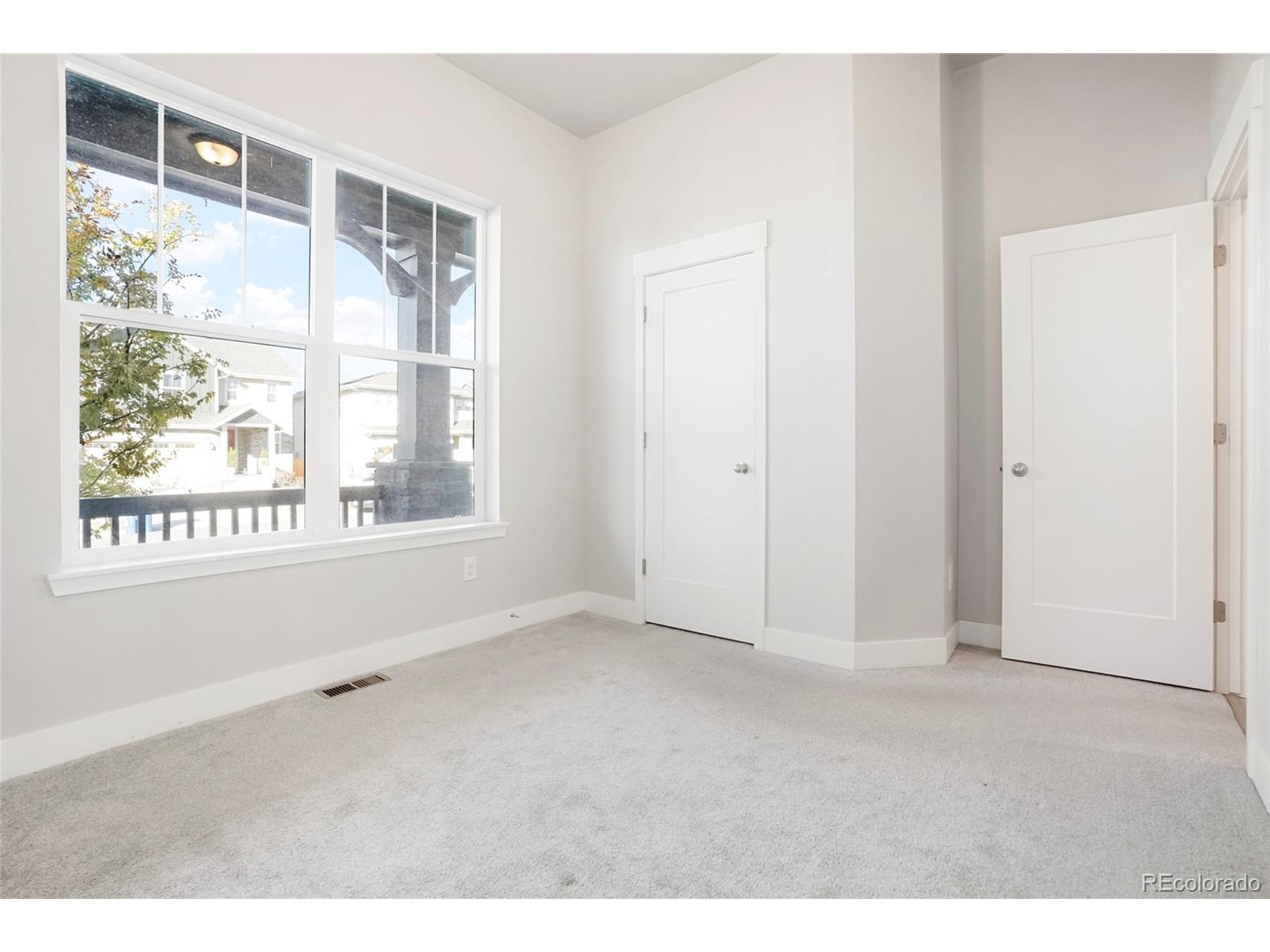 20968 East 60th Place Aurora, CO 80019 - Photo 40 of 50 a view of an empty room with a window