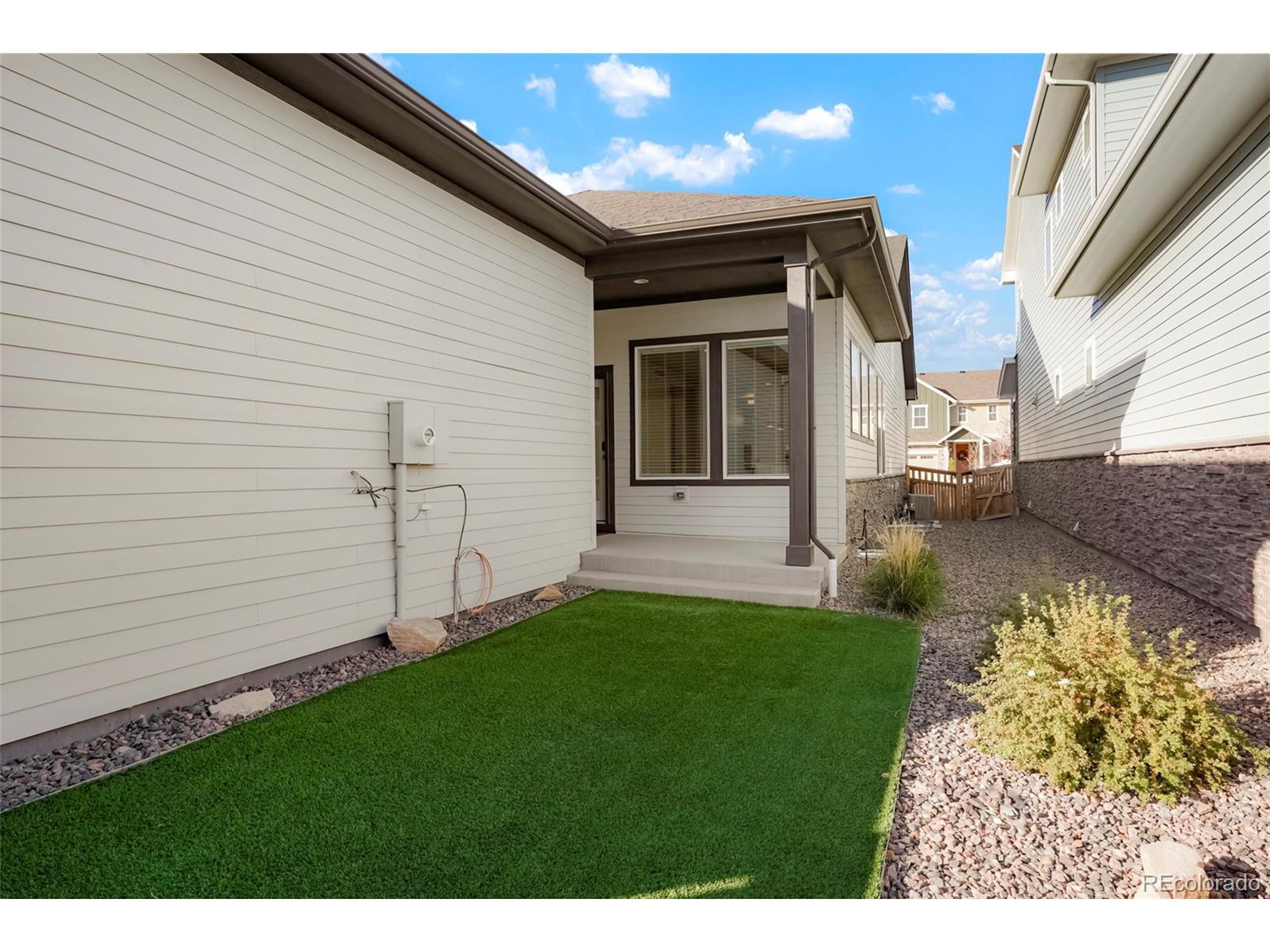 20968 East 60th Place Aurora, CO 80019 - Photo 42 of 50 a view of a porch with a yard
