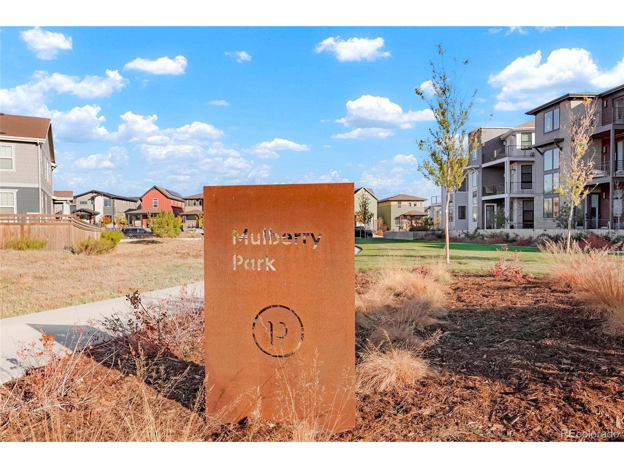 20968 East 60th Place Aurora, CO 80019 - Photo 47 of 50 a view of a street with a building in the background