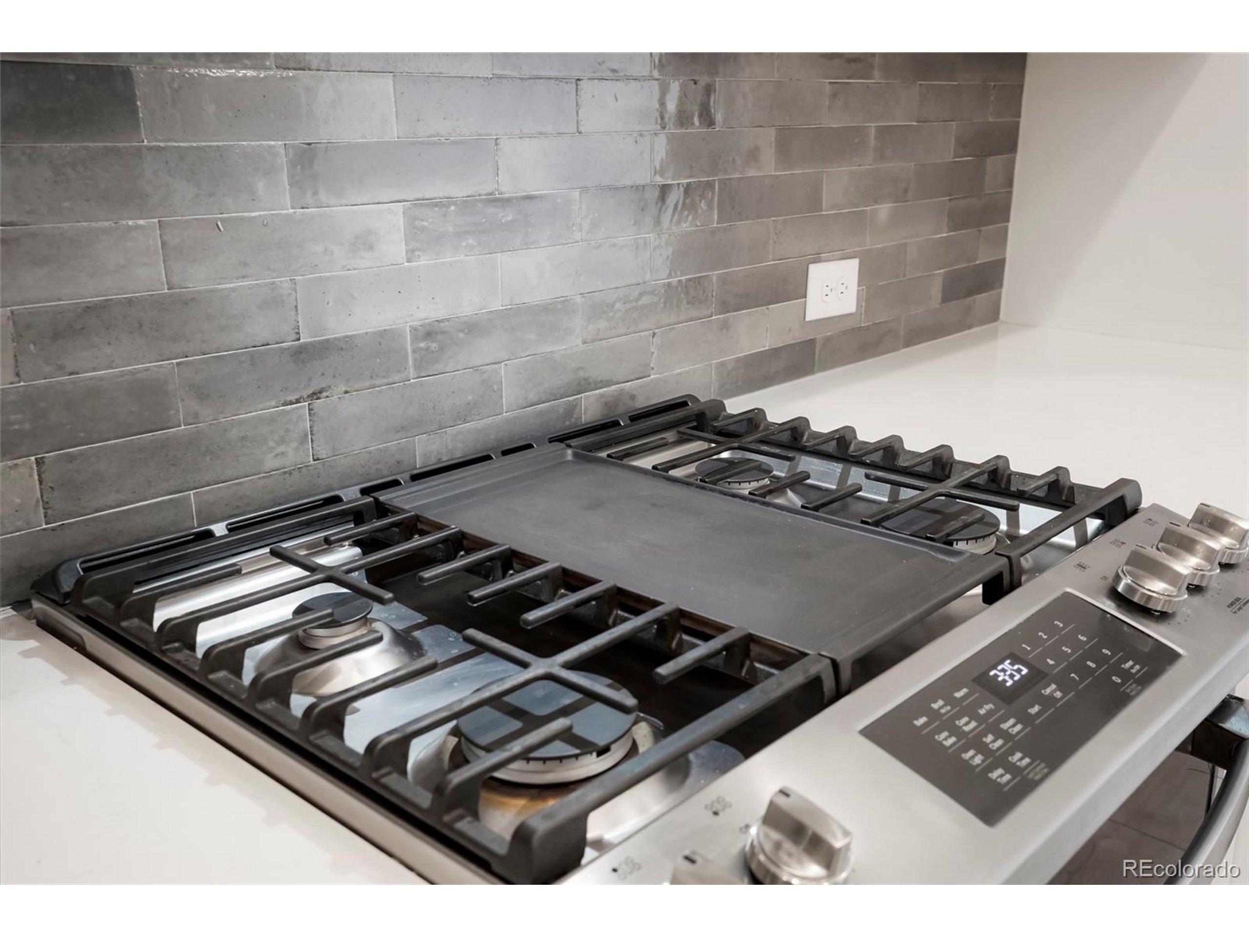 20968 East 60th Place Aurora, CO 80019 - Photo 5 of 50 a close up of a stove in a kitchen
