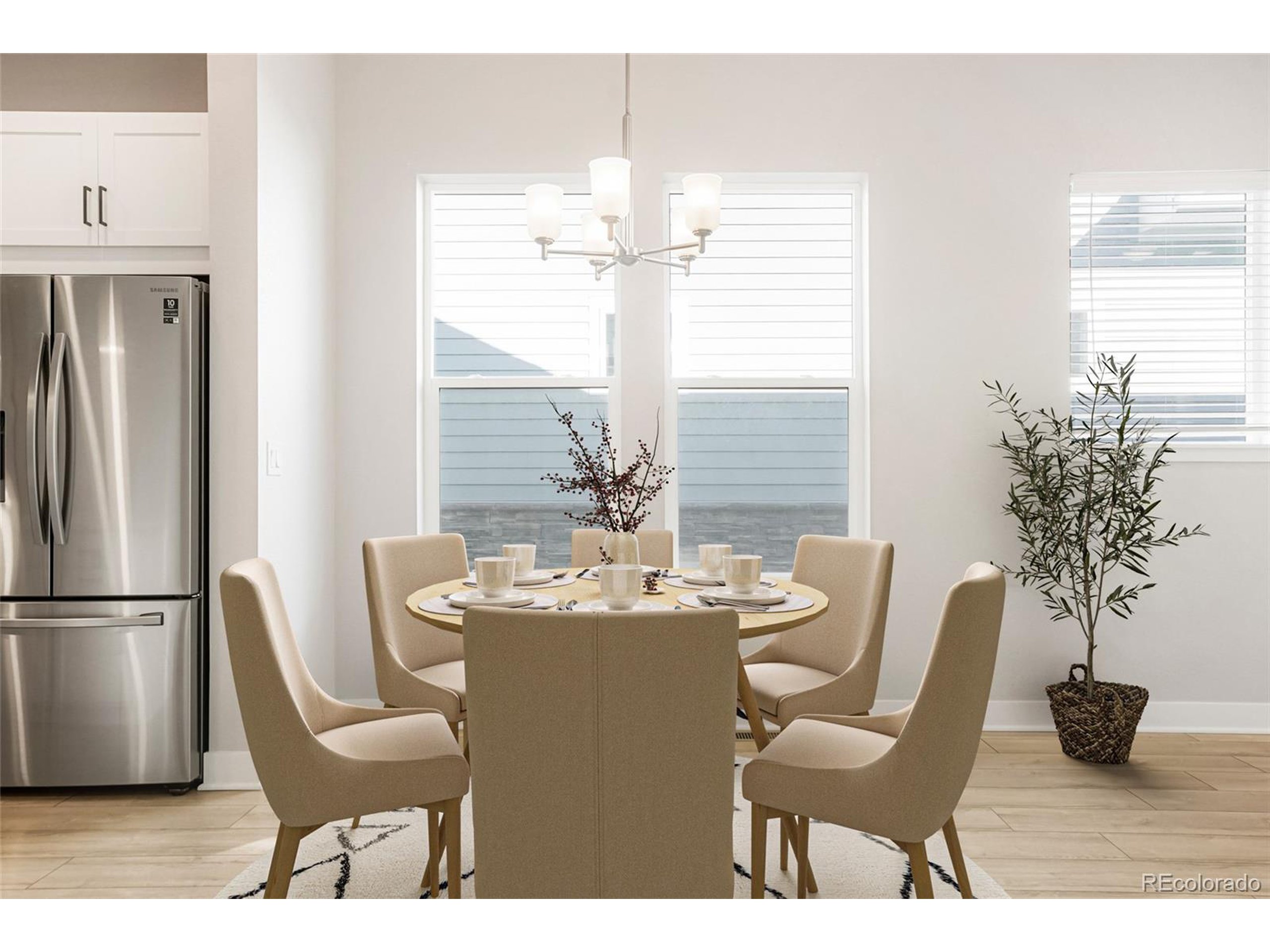 20968 East 60th Place Aurora, CO 80019 - Photo 6 of 50 a dining room with furniture a chandelier and window