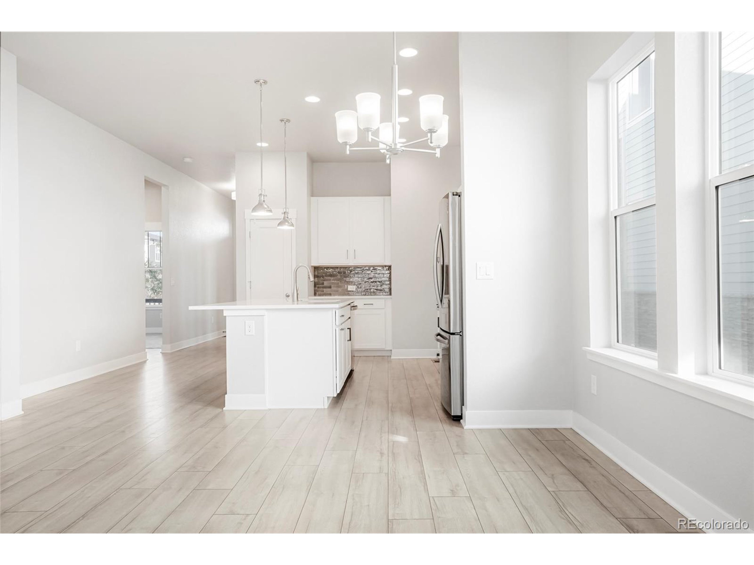 20968 East 60th Place Aurora, CO 80019 - Photo 8 of 50 a view of kitchen and windows