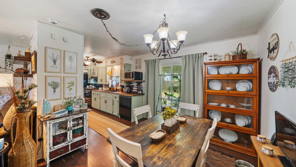 230 Dodson Street Canton, TX 75103 - Photo 7 of 17 a view of a dining room with furniture a chandelier and wooden floor