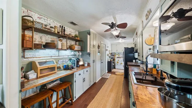 a view of a kitchen and utility room