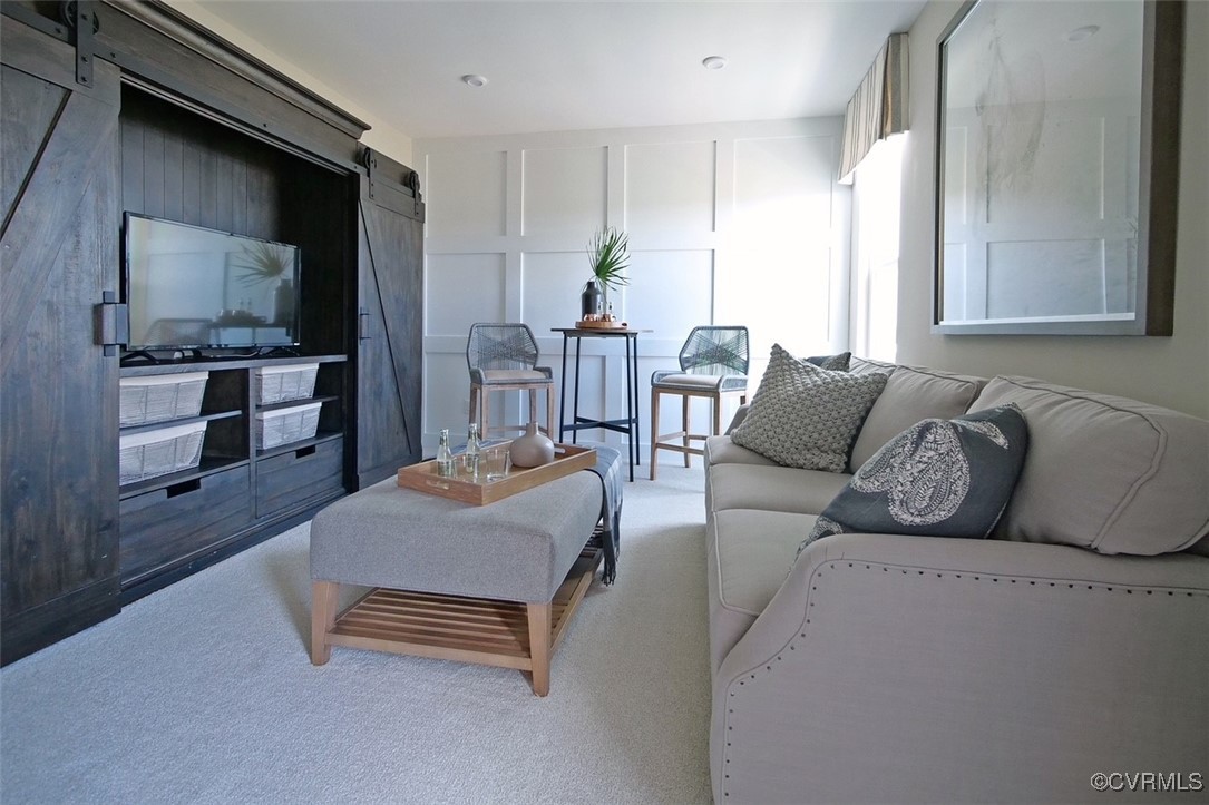 7304 Hancock Towns Lane, Unit A4 Chesterfield, VA 23832 - Photo 2 of 20 a living room with furniture and a flat screen tv