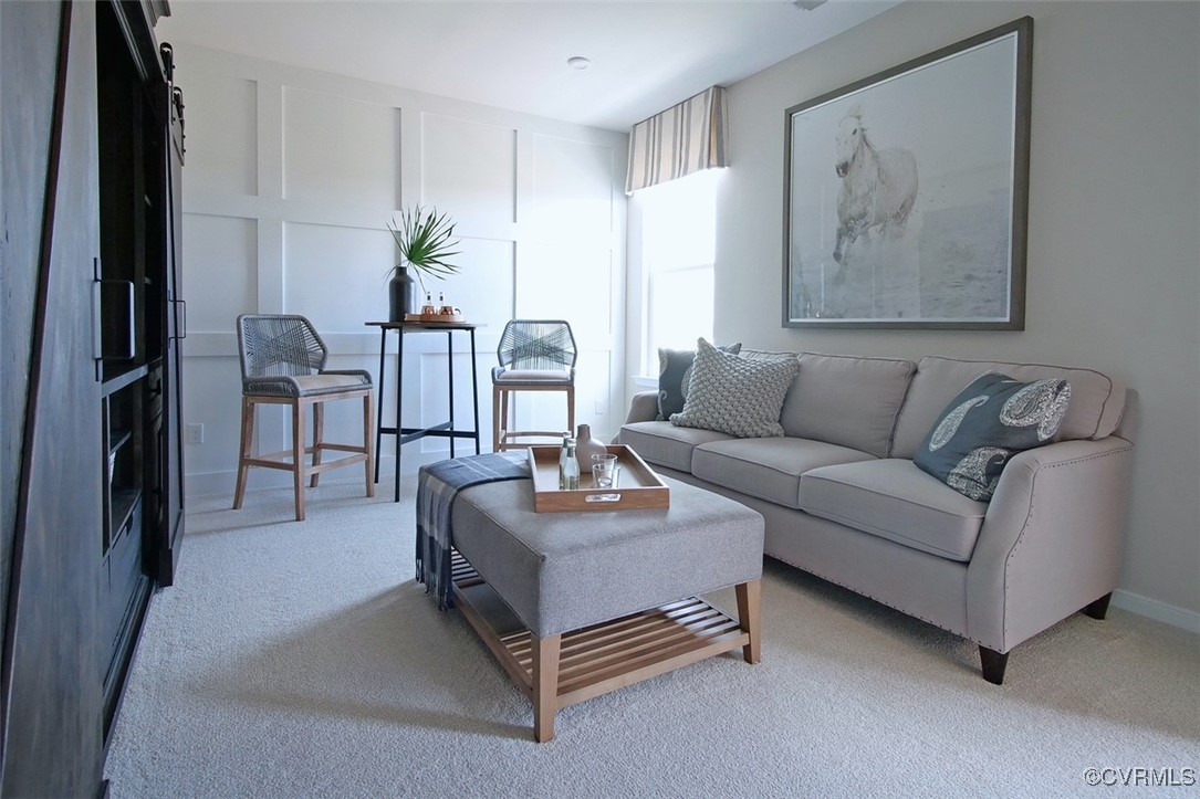 7304 Hancock Towns Lane, Unit A4 Chesterfield, VA 23832 - Photo 4 of 20 a living room with furniture and a flat screen tv