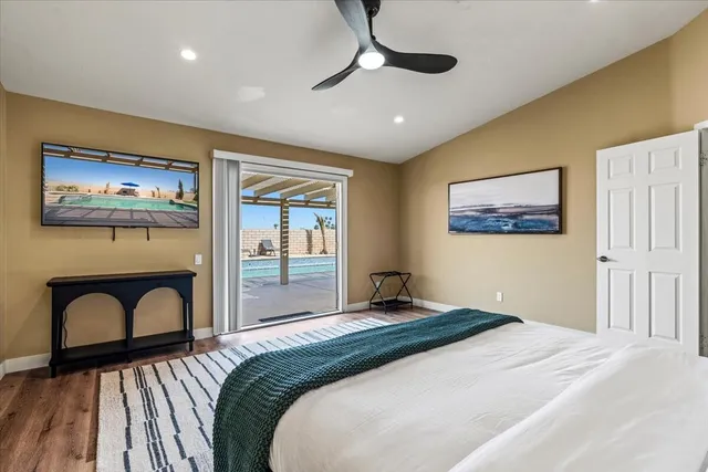 a backyard of a house with barbeque oven table and chairs