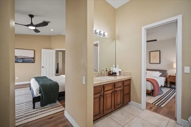 a bathroom with a sink double vanity and a mirror