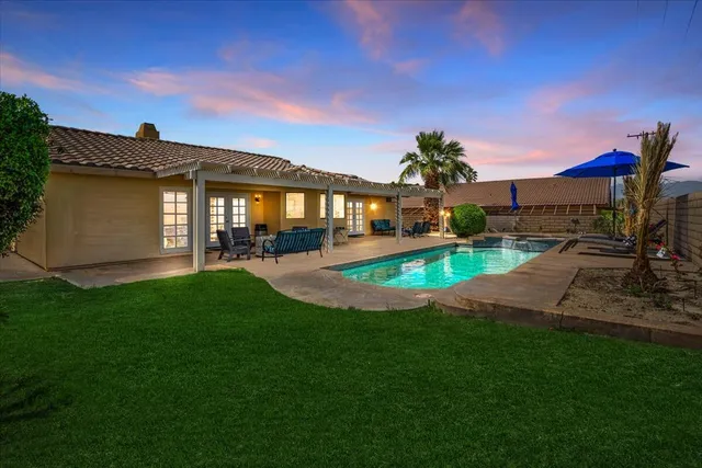 a view of a house with a swimming pool