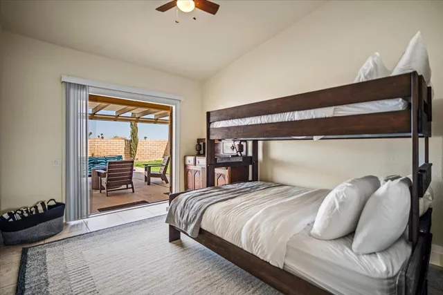 a view of a patio with table and chairs