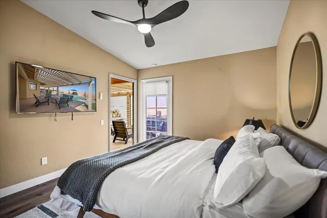 a view of a house with a backyard porch and sitting area