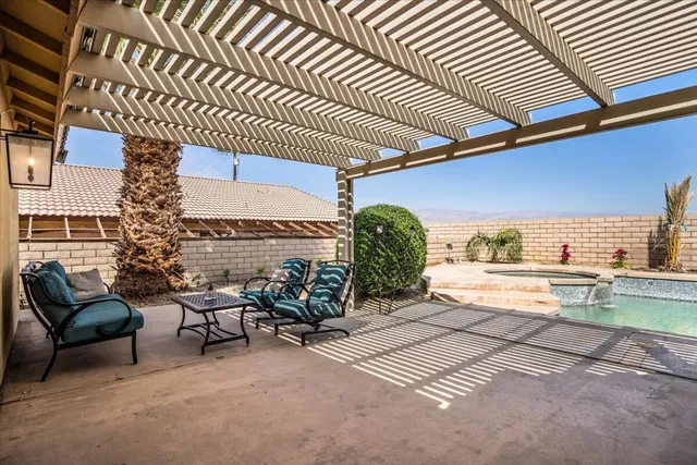 a view of a storage and utility room with washer and dryer