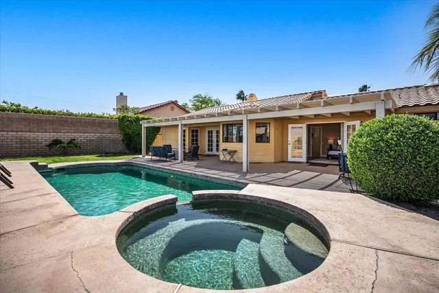 front view of a house with a swimming pool