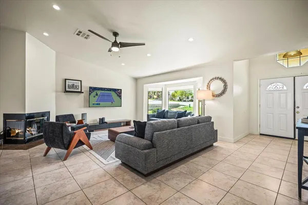 a living room with furniture and a window
