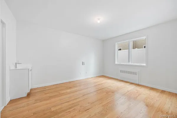a white toilet sitting next to a bathroom sink and a toilet