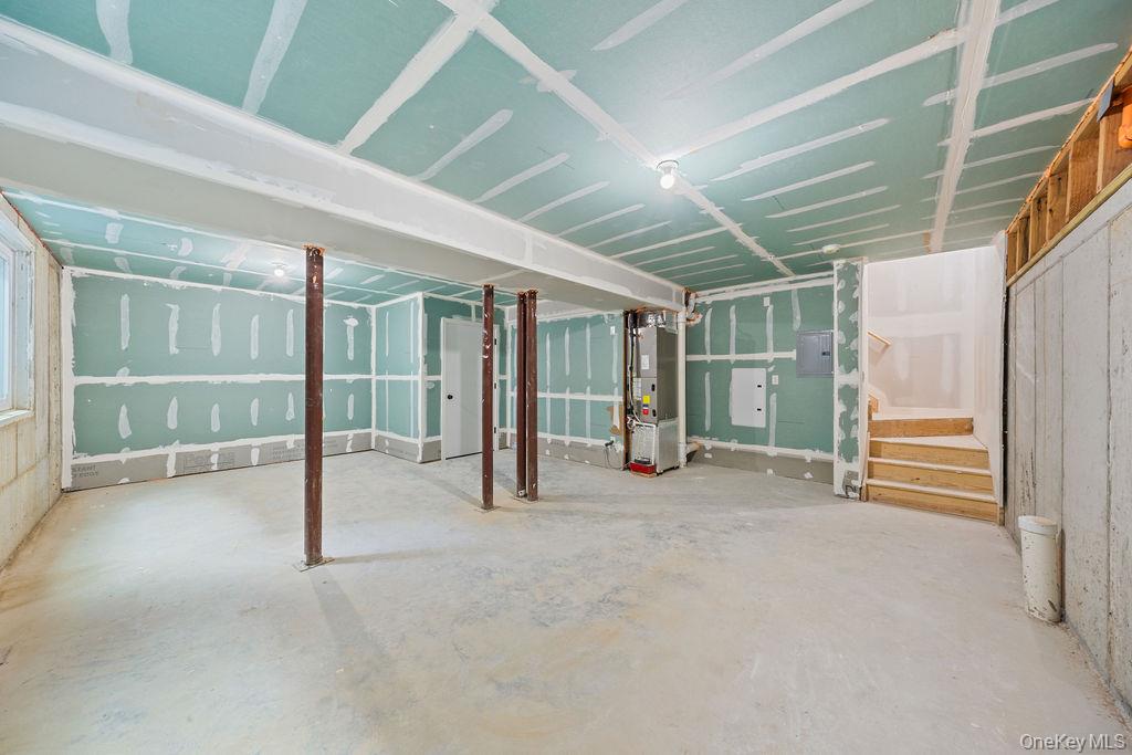 472 West Central Avenue, Unit 105 Spring Valley, NY 10977 - Photo 21 of 22 a view of an empty room with glass door and door