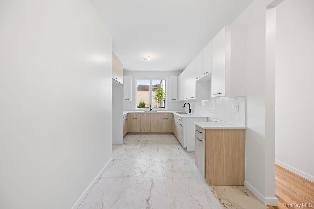 472 West Central Avenue, Unit 105 Spring Valley, NY 10977 - Photo 6 of 22 a view of a kitchen with white cabinets