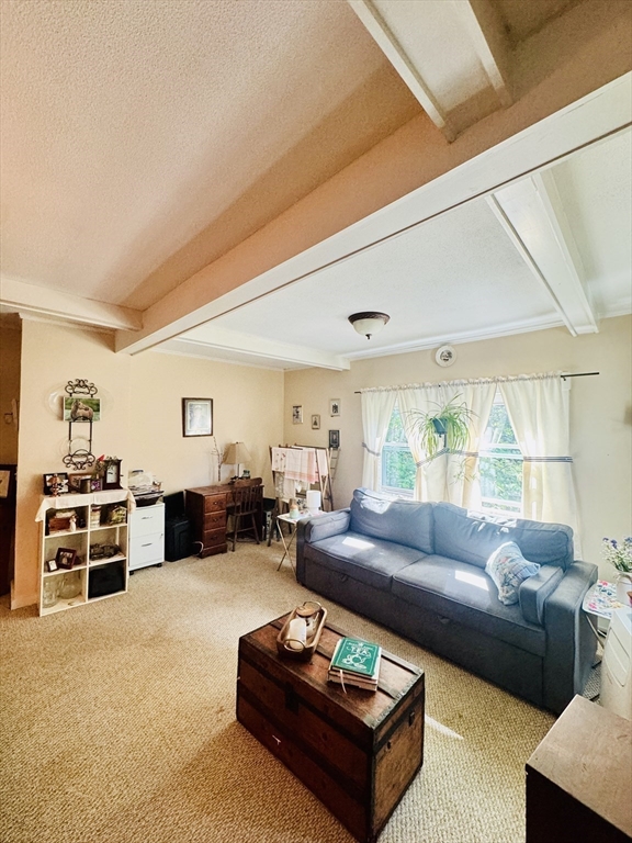 452 Hollis Road Lunenburg, MA 01462 - Photo 14 of 25 a living room with furniture and a large window