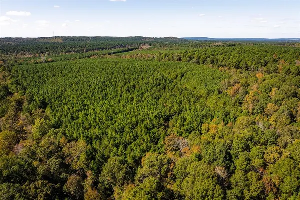 a view of a large yard with an outdoor seating