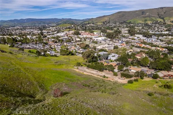 a view of a town with mountains in the background