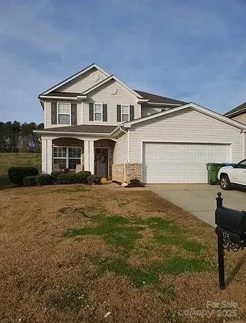 a house view with a garden space