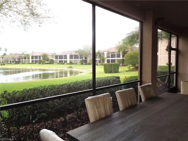 a view of roof deck with couches and ocean view