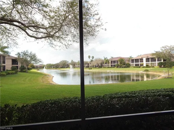 a view of a lake with a house