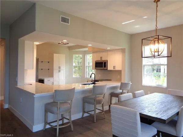 a dining room with furniture and window