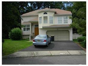 164 North Rutledge Court Matawan, NJ 07747 - Photo 1 of 1 a front view of a house with a garden
