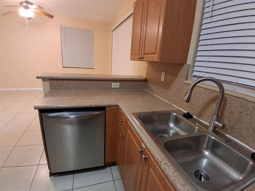 1425 Southeast 24th Court Homestead, FL 33035 - Photo 15 of 29 a kitchen with a sink and cabinets