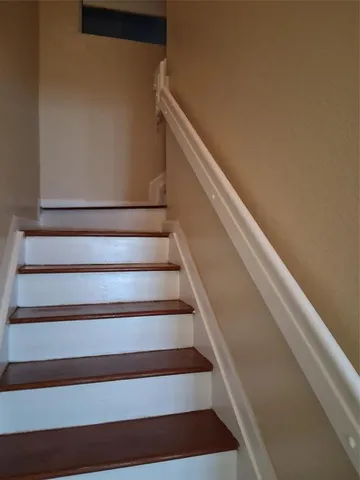 a view of a hallway with entryway door