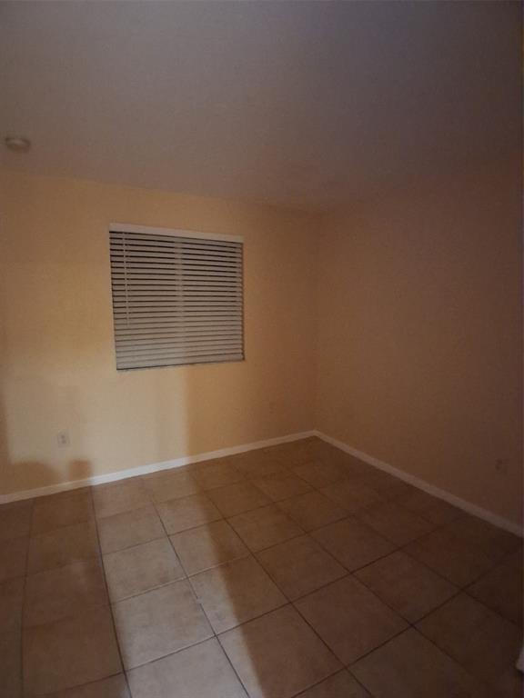 1425 Southeast 24th Court Homestead, FL 33035 - Photo 21 of 29 a view of an empty room with a window