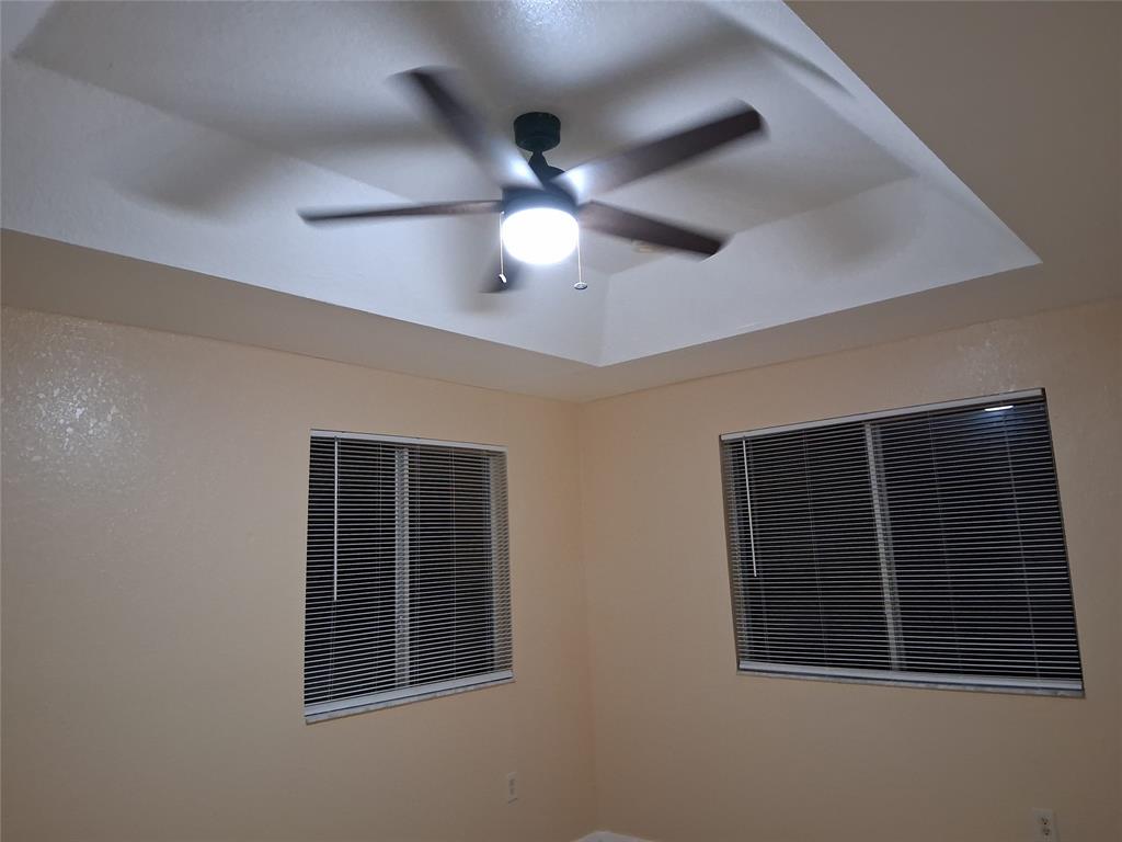 1425 Southeast 24th Court Homestead, FL 33035 - Photo 24 of 29 a view of an empty room with a ceiling fan and window