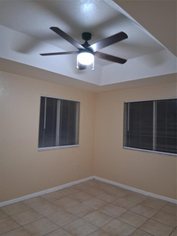 1425 Southeast 24th Court Homestead, FL 33035 - Photo 25 of 29 an empty room with wooden floor and windows