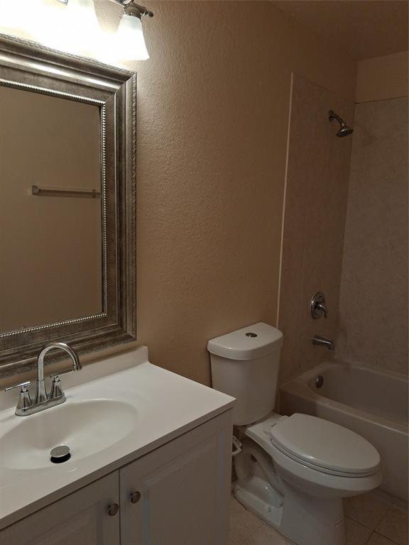 1425 Southeast 24th Court Homestead, FL 33035 - Photo 26 of 29 a bathroom with a toilet sink and mirror