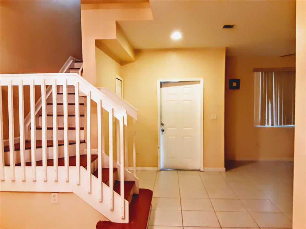 1425 Southeast 24th Court Homestead, FL 33035 - Photo 5 of 29 a bathroom with a bathtub and a shower