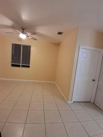 a view of an empty room with a bathroom