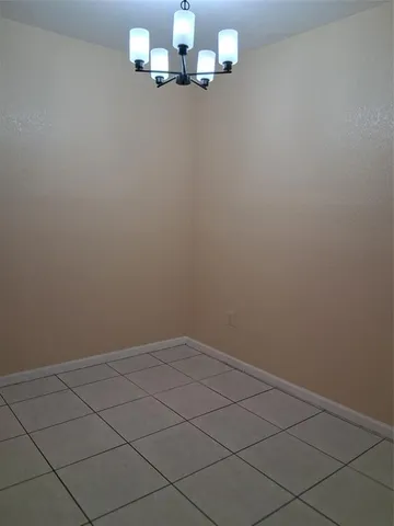 en view of empty room with wooden floor